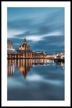 a large building sitting on top of a body of water