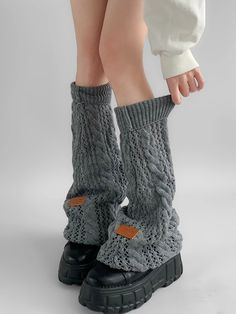 Elevate your winter wardrobe with our Gray/Black/Milk White Knit Flared Leg Warmers. Crafted from high-quality, soft knit fabric, these leg warmers are designed to provide both warmth and style. The flared design adds a touch of elegance and a retro flair, making them a perfect accessory for any outfit. Available in versatile colors of gray, black, and milk white, these leg warmers can easily be paired with skirts, dresses, or even over jeans for a chic layered look. Garment Size SizeFree SizeFull Length52Cuff16/44 Warm Stretch Winter Sweater, Black Cotton Leg Warmers For Fall, Trendy Black Cotton Leg Warmers, Black Cotton Casual Leg Warmers, Fitted Gray Winter Sweater, Snug Gray Winter Sweater, Solid Cotton Leg Warmers For Fall, Casual Black Cotton Leg Warmers, Cotton Knee-high Leg Warmers For Fall