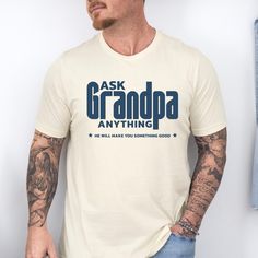 This "Ask Grandpa Anything" T-shirt is a perfect gift for the best grandpa. Made for any occasion, it is especially great as a Christmas gift. The fun and witty message makes it a unique and personal present that any grandpa will love. Give your grandpa a reason to smile with this cool, comfortable tee that he can wear all year round. Product Features: 📏 Available in multiple sizes for a perfect fit  🌟 High-quality print for vibrant colors and lasting wear  👕 Soft and breathable cotton material for all-day comfort  🔄 Easy to wash and care for; keeps its shape  🎁 Great gift idea for birthdays, holidays, or just because!  Celebrate your special papa with this unique and thoughtful T-shirt! Product Features: Fabrication: Medium fabric (6.1 oz/yd² (206.8 g/m. Garment-dyed fabric. 100% rin Crew Neck T-shirt With Lettering For Gift, Father's Day T-shirt With Lettering And Short Sleeves, Father's Day T-shirt With Lettering, Father's Day Graphic Tee With Lettering, Best Grandpa, Christmas Gift For Him, Grandpa Funny, Christmas Gifts For Him, Reasons To Smile