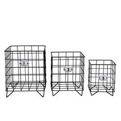 three black wire baskets sitting next to each other