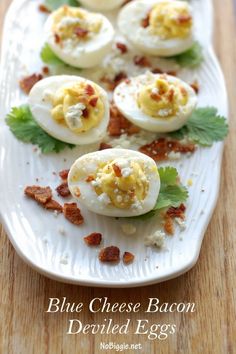 blue cheese bacon deviled eggs on a white plate