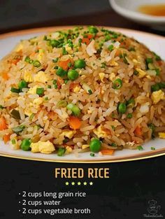 fried rice with peas and carrots on a plate