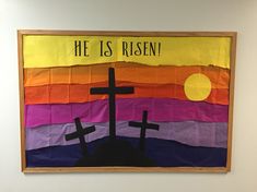 a painting with two crosses on it and the words he is risen written in black