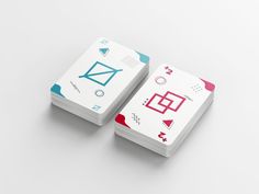 two business cards with geometric shapes on them