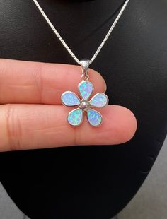 "Sterling Silver Forget Me Not Flower Necklace Blue Opal Flower Necklace Metal: All components are made from solid .925 Sterling Silver Stone: Lab created Opal Measurement: pendant height is 25mm (0.98\")including bail and 18mm (0.71\") wide Choose Chain Length At Checkout Please feel free to Convo me with any questions before purchasing. Please view policy before purchasing Other Opal Necklaces can be found here https://www.etsy.com/shop/LinksAndStones?ref=ss_profile§ion_id=24284450 Thank You F Blue Sterling Silver Necklace With Flower Charm, October Birthstone Jewelry, Blue Opal Necklace, Sparkly Necklace, Fire Opal Necklace, Bee Necklace, Birthstone Gifts, Opal Necklace, Metal Necklaces