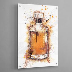 an art piece on the wall with a painting of a perfume bottle in orange and yellow