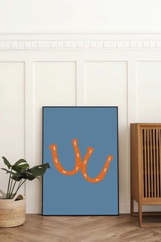 there is an orange umbrella on the blue background in front of a wooden chair and potted plant