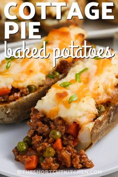 baked potatoes topped with meat and cheese on a white plate next to another dish in the background