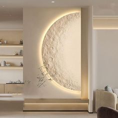 a living room filled with furniture and a large moon wall art on the wall next to a couch