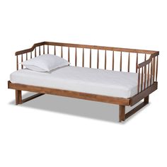 a wooden daybed with white sheets and pillows on it's bottom half, against a white background