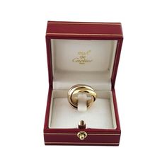 Cartier 18K Tricolor Gold Trinity Ring Size 4.5  This elegant triple band ring by Cartier is crafted in beautifully detailed 18K yellow, white and rose gold. Each band measures 3.9 mm.  Ring Size: 4.5  Weight: 6.79 dwt./10.56 gr.  Hallmark:  750 CARTIER 48 1997  Very good condition, professionally polished.  Will come packaged in a gift box or pouch (when possible) and will be shipped U.S. Priority Mail Insured. Cartier Triple Ring, Gold Jewelry For Anniversary With Original Box, Gold Jewelry For Anniversary In Original Box, Cartier Yellow Gold Rings Perfect For Gifts, Classic Jewelry With Original Box, Gold Wedding Jewelry With Original Box, Gold Trinity Ring, Triple Band Ring, Art Deco Sapphire Ring