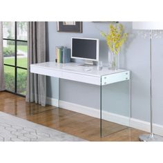 a white desk with a computer on it