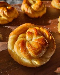 several pastries on a wooden cutting board