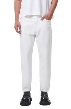 Relaxed but not baggy, these tapered jeans are made from nicely draped nonstretch denim in a bright-white wash that looks good any time of year. 30 1/2" inseam; 14" leg opening; 12" front rise; 14" back rise (size 29) Zip fly with button closure Five-pocket style 100% organic cotton Machine wash, tumble dry Made in Turkey White Straight Hem Jeans For Summer, White Straight Hem Summer Jeans, Classic White Tapered Leg Jeans, White Relaxed Fit Cropped Jeans, White Tapered Cotton Bottoms, White Tapered Leg Jeans, White Tapered Cotton Pants, Casual White Tapered Pants, White Relaxed Fit Jeans With Tapered Leg