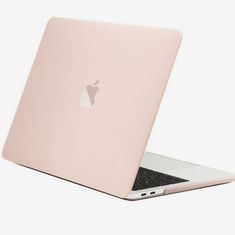 an apple laptop computer sitting on top of a white table