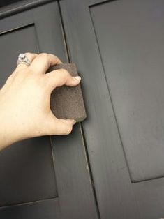 a person is cleaning the front door with a sponge on it's side pocket