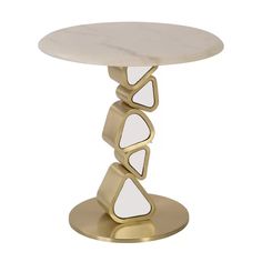 a white marble topped table with gold metal base and three geometric shapes on the top