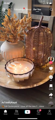 candles are on a tray next to a pumpkin