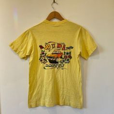 **Rare Design** Vintage1980's Datsun Graphic Tee Sz S. "Do It In A Datsun". Men's/Unisex Size Small. Fabric Is Super Soft And Well Taken Care Of. A Few Small Stains As Seen In Photos. Truly Rare & Hard To Find Online. Dm For Measurements. #Datsun #Vintage #Moto #Car #1980s Moto Car, Yellow Orange, Orange Yellow, Random Stuff, Graphic Tee, Do It, Graphic Tees, Tee Shirts, Mens Shirts