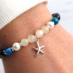 Get ready for summer with our silver starfish charm bracelet! You'll love the beautiful bead combination and beachy feel. We've added a sterling starfish to complete this lovely beaded bracelet. ABOUT: * Materials: sterling sliver lobster claw and sterling silver 1.5 inch extension * Charm: sterling silver (1x1cm) * Beads: freshwater pearl, agate, sun stone, sea sediment jasper, sterling beads * Width: 6mm SHOP OUR BRAND > https://rosaperlina.etsy.com WHAT IS STERLING SILVER? * Sterling silver i Clean Sterling Silver, Ocean Jewelry, Jewelry For Women, Charm Bracelets, Starfish, Deodorant, Freshwater Pearls, Beautiful Jewelry, Natural Gemstones