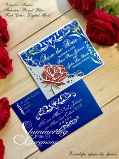 the wedding stationery is blue and has red roses