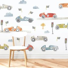 a child's room with a wall mural featuring race cars and traffic lights on it