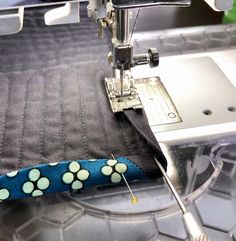 a sewing machine with a blue and white polka dot design on it's side