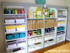 an organized craft room with lots of storage