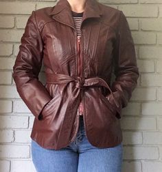 Incredible vintage red genuine leather belted jacket. Size 9/10. Perfect fall jacket. Retro Belted Fall Outerwear, Retro Belted Outerwear For Fall, Brown Belted Fitted Leather Jacket, Vintage Fitted Belted Outerwear, Fitted Vintage Belted Outerwear, Fitted Vintage Outerwear With Belt Loops, Fitted Vintage Burgundy Outerwear, Fitted Burgundy Vintage Outerwear, Vintage Burgundy Outerwear For Fall