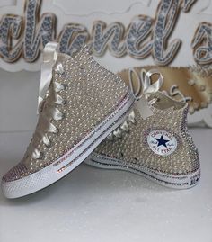 Custom Bling Converse All Star Chuck Taylor Sneakers. All designs handmade and embellished with a variety of high quality crystals. Great for weddings, proms, homecomings, birthdays, special events or just your everyday girly girl. **IF YOU NEED THIS ITEM BEFORE THE PROJECTED SHIPPING TIME YOU MUST CONTACT US BEFORE ORDERING (additional charges may apply) ** Shoe Details: Ivory high top Converse All Star Chuck Taylor Sneaker (Canvas Material) Shoe Size: Sizes stating at women's size 6 to women's Converse Wedding Shoes, Bedazzled Shoes, Custom Sneakers Diy, Ribbon Shoes, Bling Converse, Diy Sneakers, Wedding Converse, Bling Shirts, High Top Converse