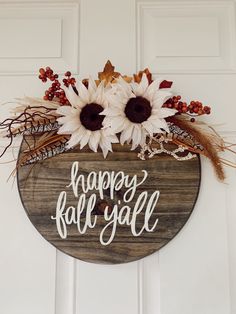 a wooden sign that says happy fall y'all with sunflowers on it