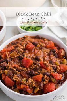 a white bowl filled with black bean chili