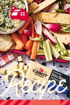 an assortment of cheeses, crackers, and vegetables on a table with the words ricotta