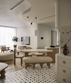 a living room filled with furniture and white walls