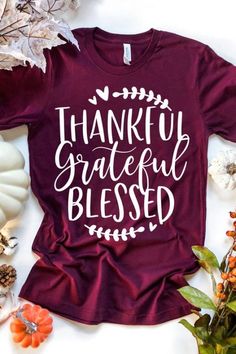 a t - shirt that says, thank grateful and is surrounded by fall leaves