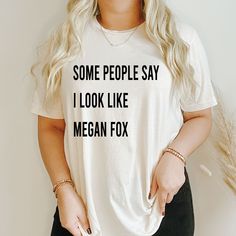 a woman wearing a t - shirt that says, some people say i look like megan fox