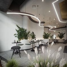 the interior of a restaurant with tables and chairs, potted plants, and lights