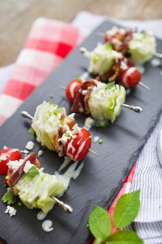 small appetizers with tomatoes, lettuce and cheese