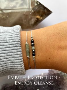 Ultimate Empath Protection Set Labradorite - Tourmaline - hematite  This bracelet comes on a description card  ➵Tube dimensions are 4x13mm ➵Tube bead labradorite (top bracelet) ➵3mm tiny spheres (bottom bracelet) *Stone sizes will slightly vary  ➵Both bracelets have silver colored spacers ➵Stone colors WILL vary as these are natural gemstones.  ➵Nylon string colors will slightly vary ➵0.8mm nylon cord for a light comfortable wear.  ➵Keep bracelet away from water as the nylon dye may fade. ➵Some gemstones do not mix well with water so keep dry. ➵Nylon textures may vary ➵Spacer sizes may slightly vary Sizing:  ➵Adjustable knot - Tighten / loosen bracelet with the adjustable option. ➵One size fits MOST. Fits 5 - 7.5 inch wrist please message me if you would like it larger.  PLEASE READ:  ➵ Du Protection Bracelet Spiritual, Negative Energy Cleanse, Keep Bracelet, Empath Protection, Bracelet Stone, Adjustable Knot, White Jewelry Box, Energy Cleanse, Spiritual Power