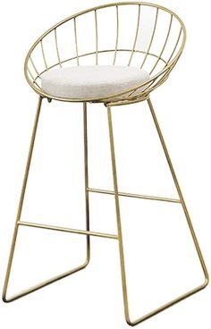 a gold metal bar stool with a white cushion