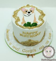 a white and gold birthday cake with a dog on it