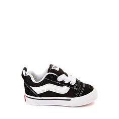 a child's black and white sneaker