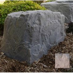 two large rocks sitting next to each other