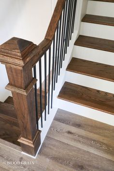 some wooden stairs and railings in a house