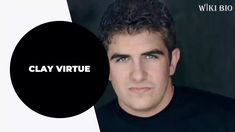 a man with curly hair and black shirt is looking at the camera while wearing a black t - shirt that says clay virtue