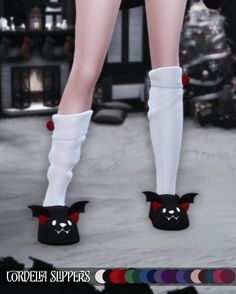 the legs and feet of a woman wearing white socks with bats on them, in front of