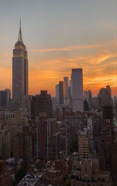 the sun is setting over new york city