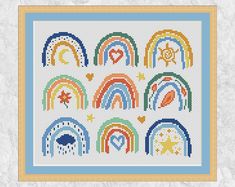 a cross stitch pattern with rainbows and stars