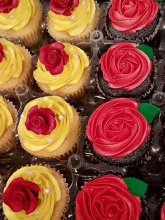 cupcakes decorated with red and yellow frosting