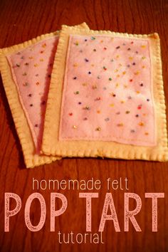 two homemade felt pop tarts are sitting on a table with the words, homemade felt pop tart